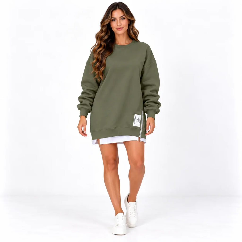 Army green front: Model wearing an army green long sleeve sweater dress with a side zipper and printed hem label.