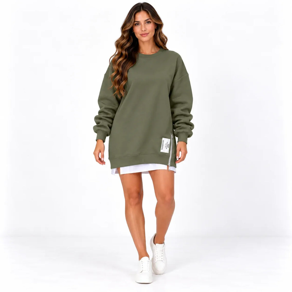 Army green front: Model wearing an army green long sleeve sweater dress with a side zipper and printed hem label.