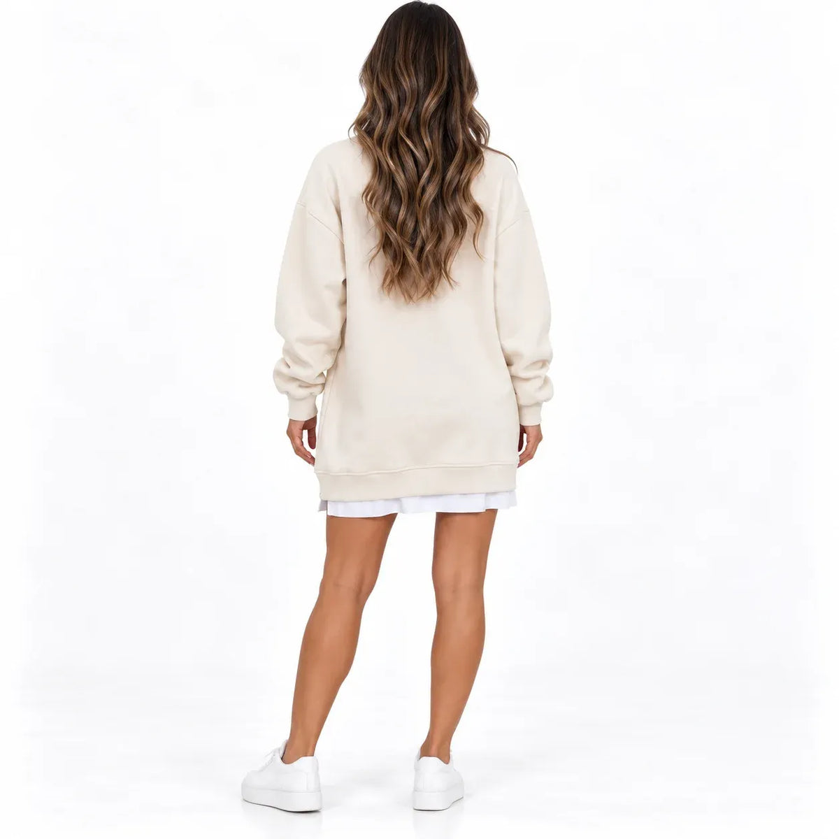 Beige back: Back view of a beige long sleeve sweater dress with cuffed sleeves and a ribbed hem.