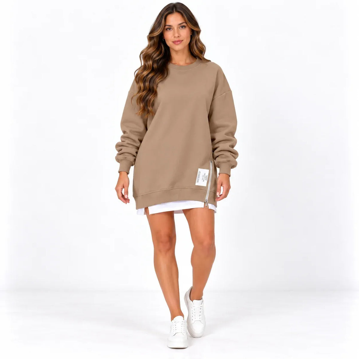 Brown front: Model wearing a brown long sleeve sweater dress with a round neckline and zipper detail near the hem.