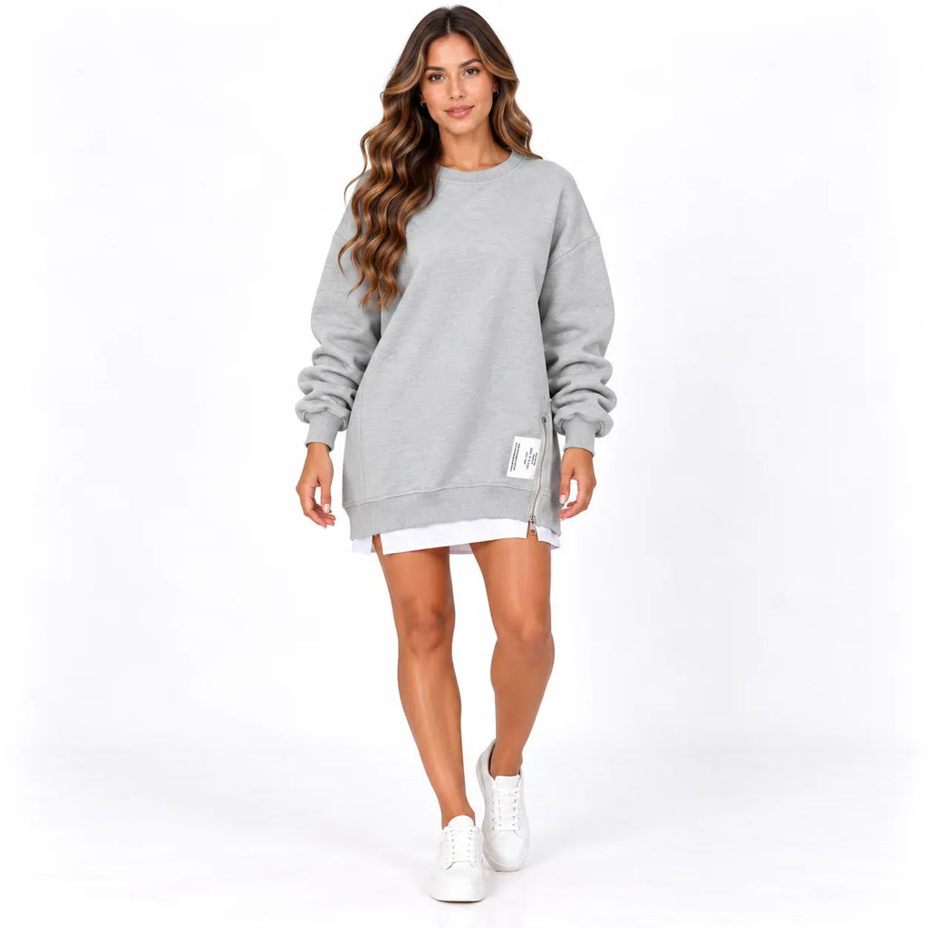 Grey front: Model wearing a grey sweater dress with long sleeves, ribbed trim, and a side zipper.