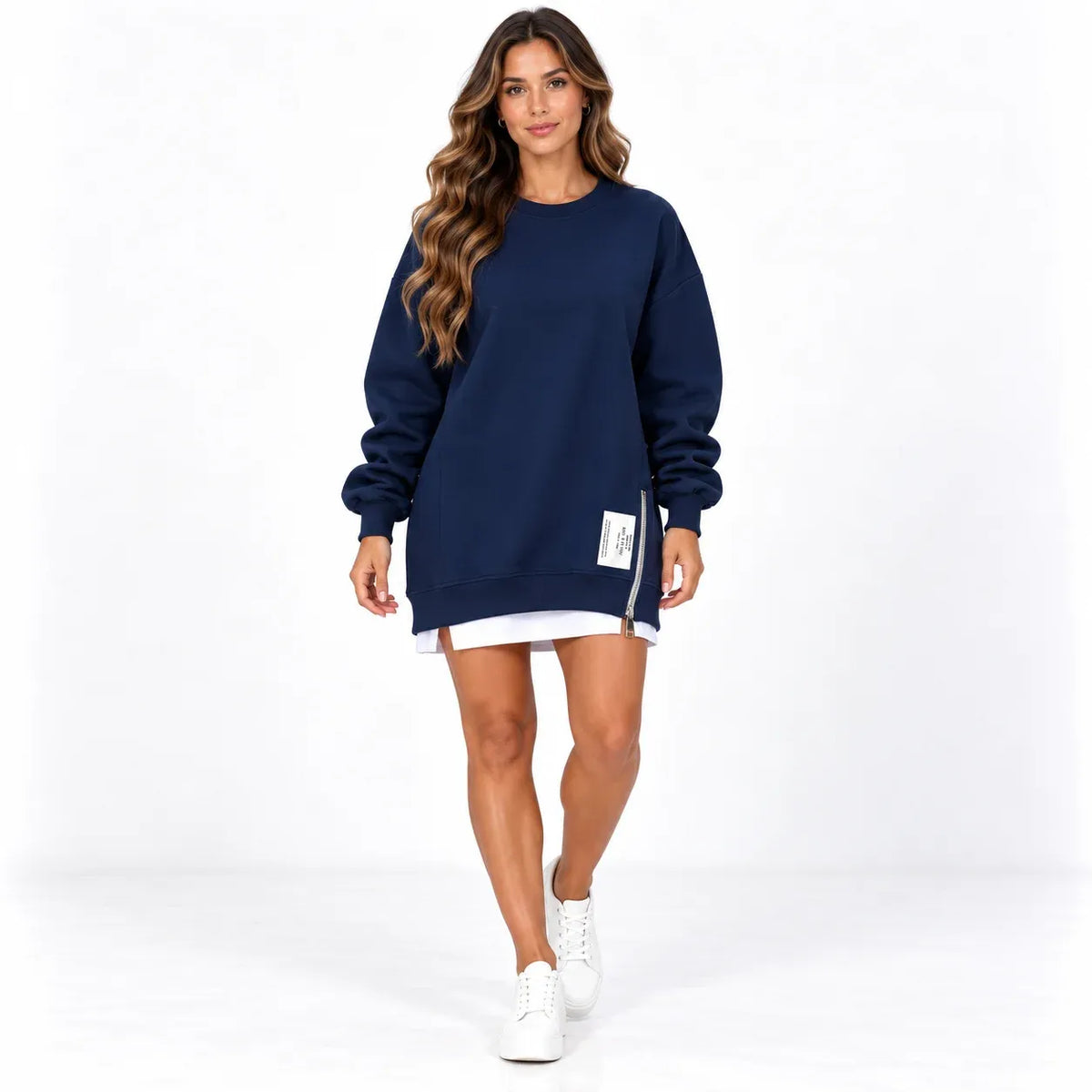 Navy blue front: Model wearing a navy blue long sleeve sweater dress with a side zipper and white printed label.
