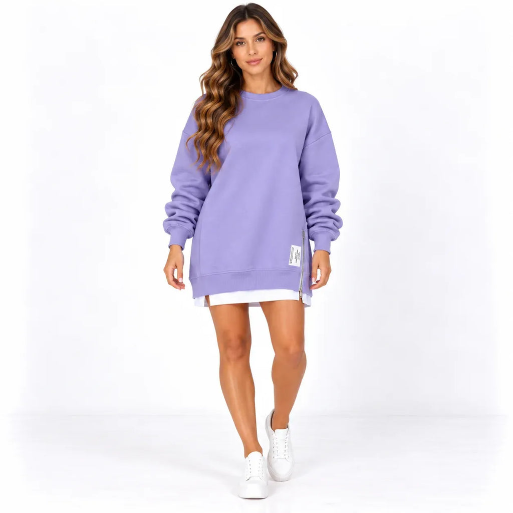 Purple front: Model wearing a purple long sleeve sweater dress with ribbed trim and a side zipper.