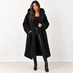 Black: Women's black longline teddy fleece coat with hood and wide lapels, shown from the front.