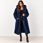Dark blue: Women's dark blue hooded teddy fleece coat worn open over a black top and pants, front view.