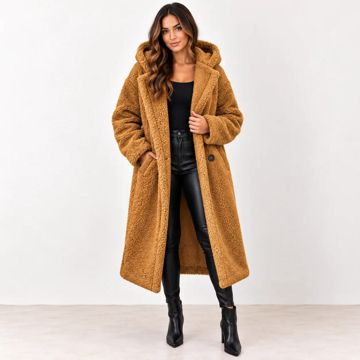 Golden camel: Women's golden camel longline teddy fleece coat showing the hood, textured surface, and front pockets.