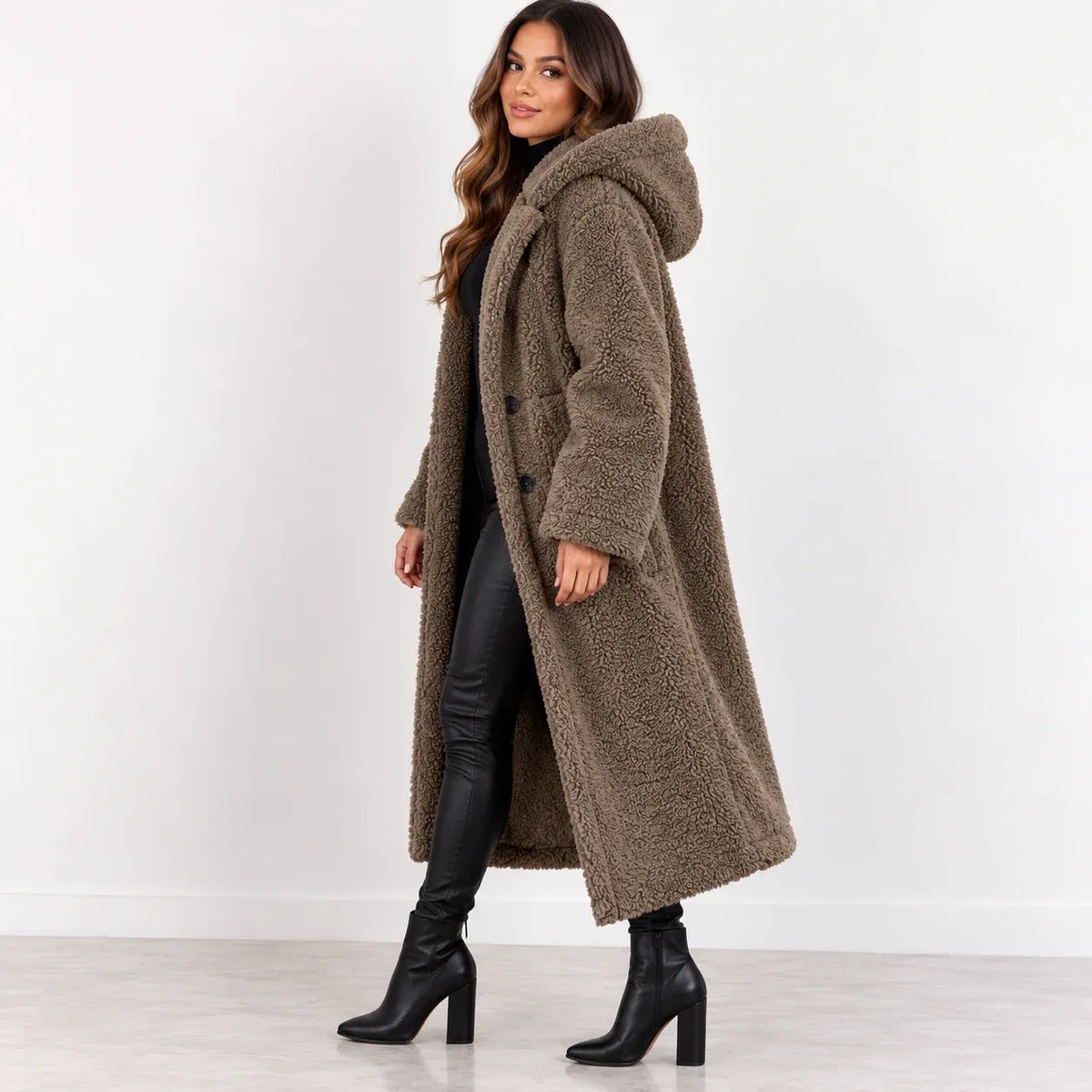 Khaki, side: Side view of women's khaki teddy fleece coat showing the hood, long sleeves, and below-knee hem.
