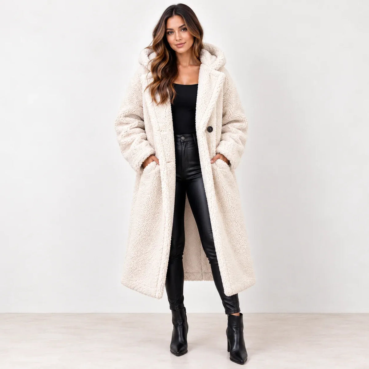 Off white: Women's off-white hooded teddy fleece coat with dark buttons, shown with both hands in the front pockets.