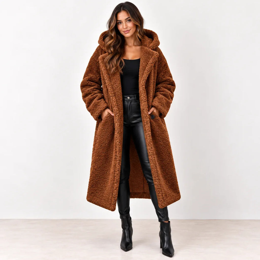 
Reddish brown: Women's reddish-brown longline teddy fleece coat worn open, showing the hood and front pockets.