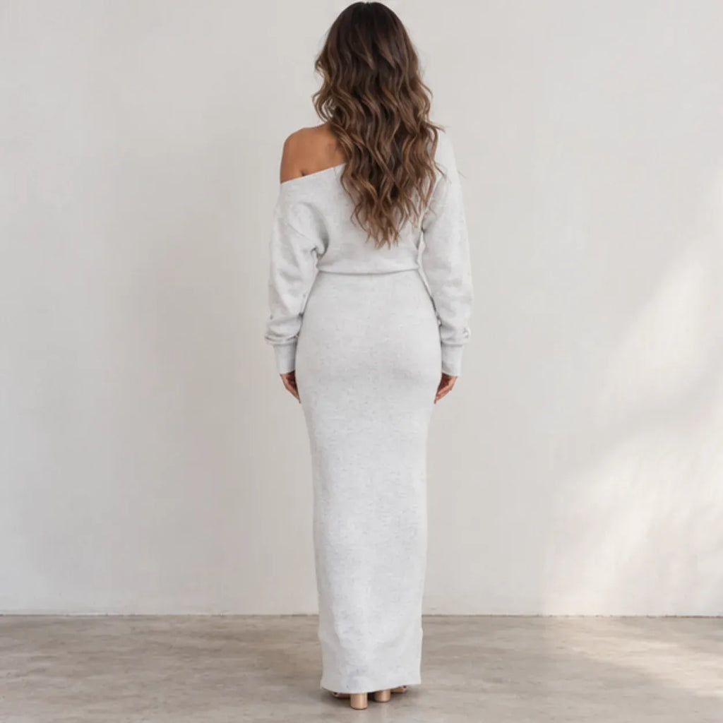 Back view of women’s light gray off-shoulder knit bodycon maxi dress with long sleeves