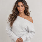 Close-up of women’s light gray off-shoulder knit maxi dress showing the knit texture and neckline