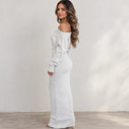 Side view of women’s light gray off-shoulder knit bodycon maxi dress