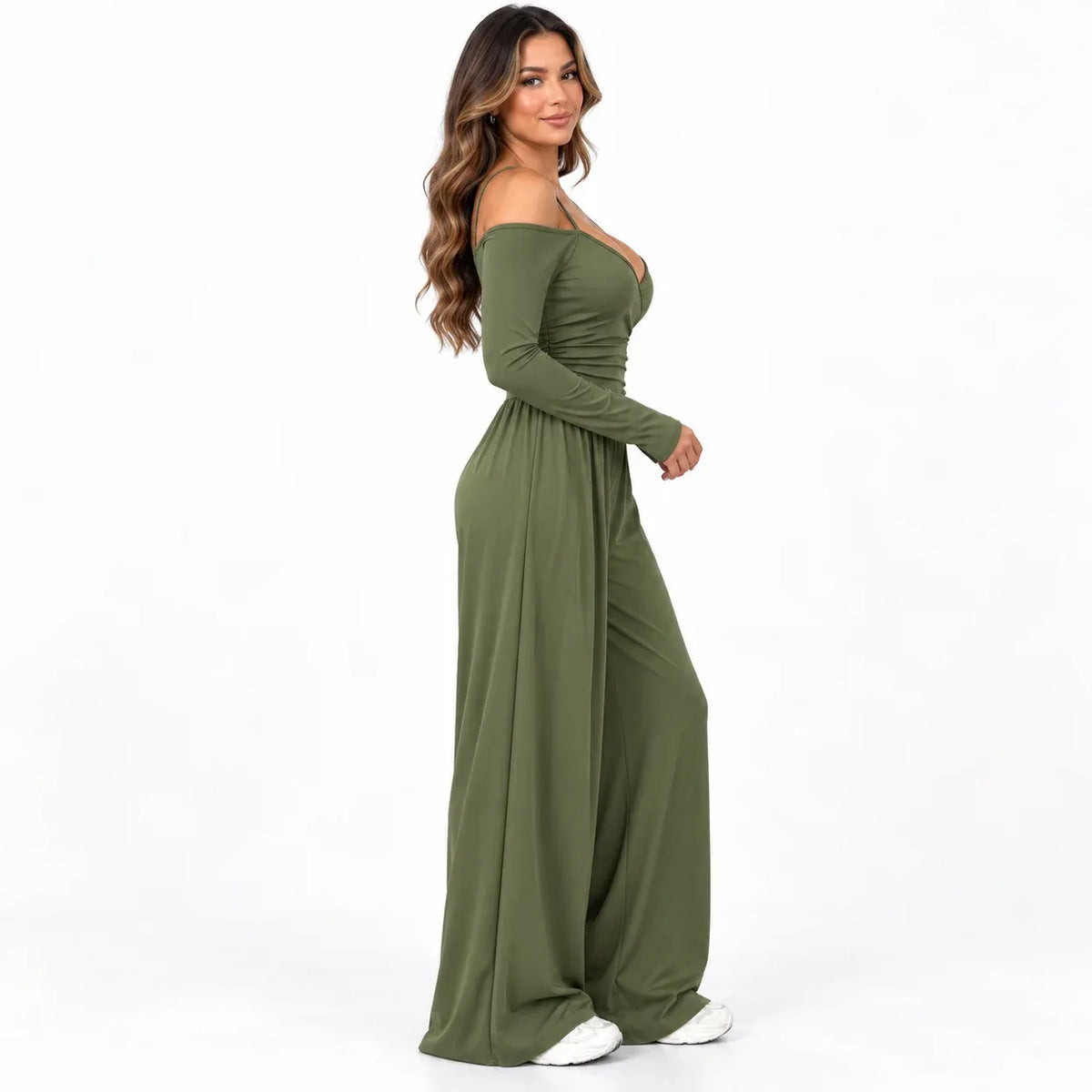 Olive green side: Side view of an olive green off-shoulder jumpsuit showing long sleeves and full-length wide legs.
