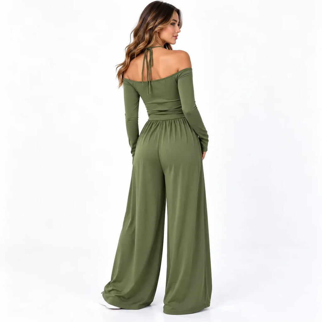 Olive green back: Back view of an olive green wide-leg jumpsuit showing an off-shoulder neckline and neck tie straps.