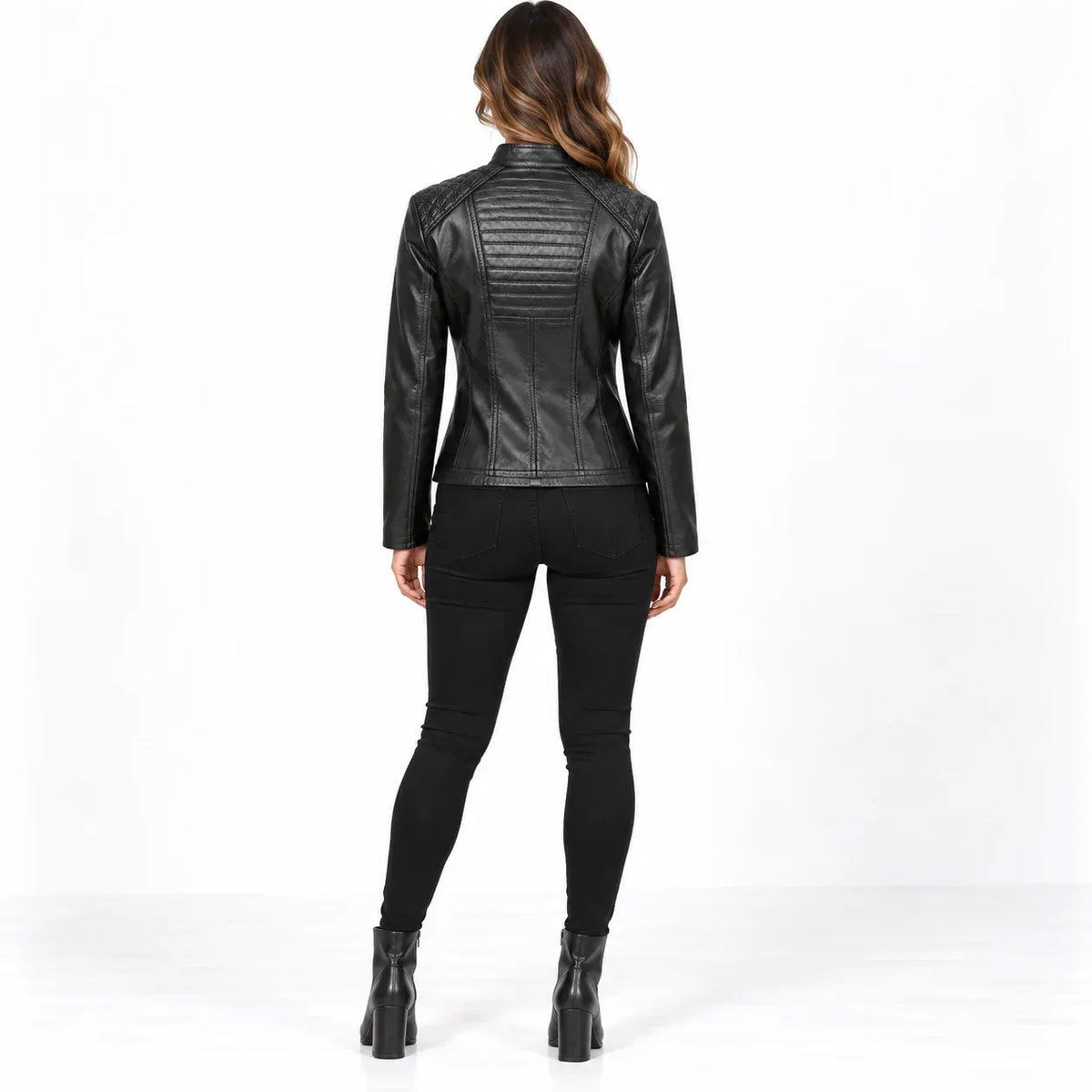 Black back: Back view of a black faux leather jacket showing horizontal stitched panels and shaped seam detailing.