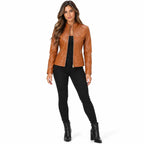 Brown front: Model wearing a brown quilted faux leather jacket with a stand collar and zippered front pockets.