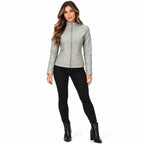 Grey front: Model wearing a grey quilted faux leather jacket zipped up, with horizontal stitched chest panels.