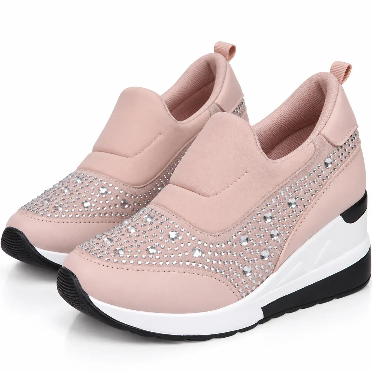 A pair of women's slip-on wedge sneakers in light pink, featuring silver rhinestone embellishments on the toe and side panels, with a white and black wedge sole.