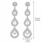 A pair of silver-tone dangle earrings with clear rhinestones, shown with dimension lines indicating a height of 7.6 cm (2.