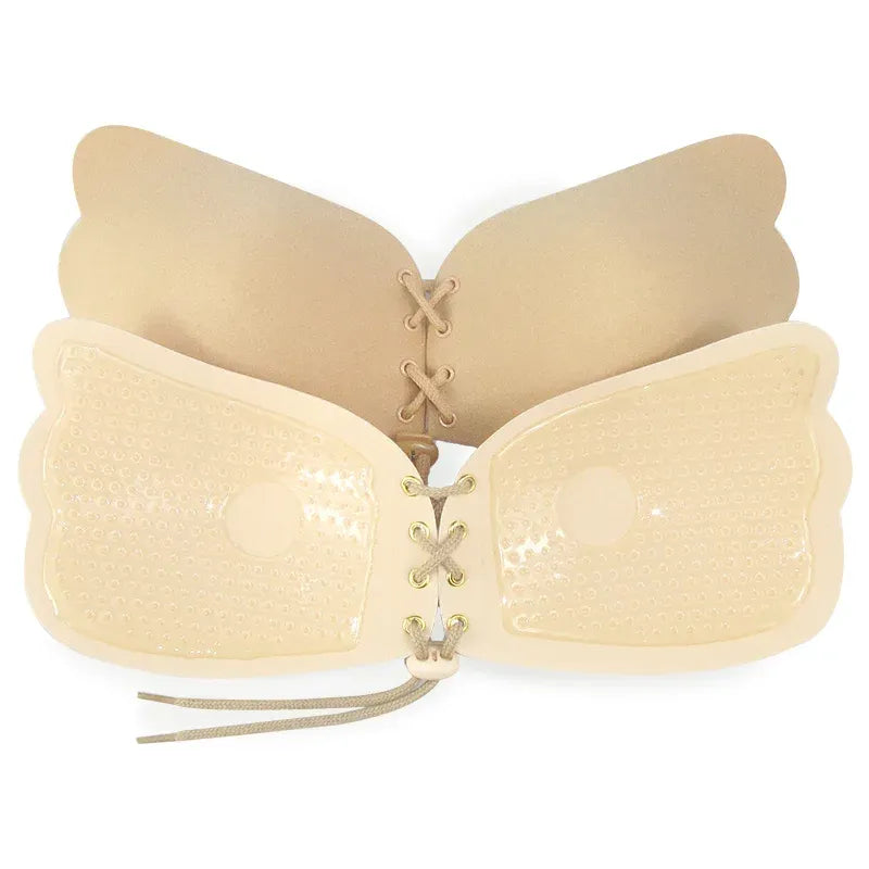 Beige strapless bra with lace-up front on a white background