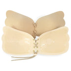 Beige strapless bra with lace-up front on a white background