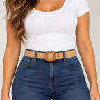 Apricot, close-up: Close-up of an apricot woven belt showing the textured band, rounded-square buckle, and silver-tone fastening pin.