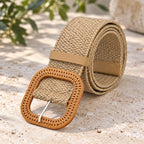 Khaki: Khaki woven elastic belt rolled up with a tan rounded-square buckle and matching keeper loop.
