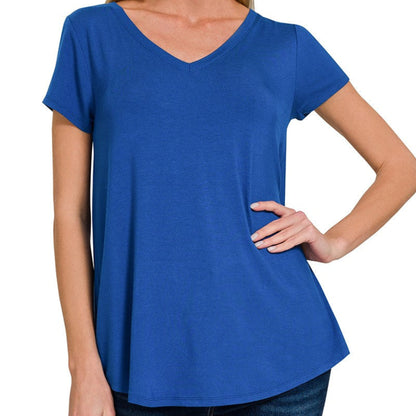 Woman wearing a light navy blue t-shirt on a white background
