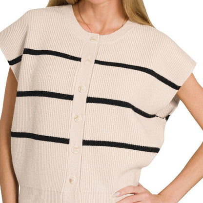 Woman wearing a sand beige cardigan with black stripes on a white background