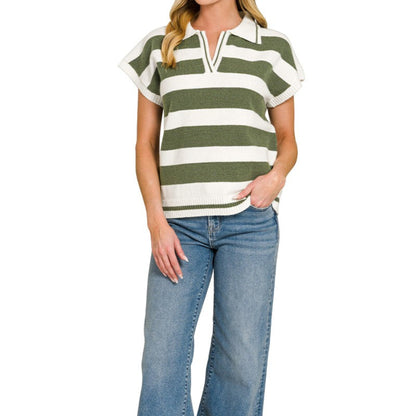 Woman wearing a green and white striped shirt with blue jeans on a white background