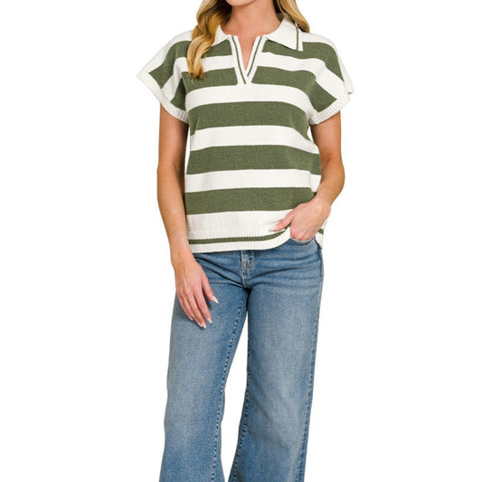 Woman wearing a green and white striped shirt with blue jeans on a white background