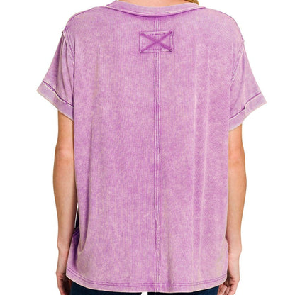 Person wearing a purple t-shirt with a logo on the back against a white background
