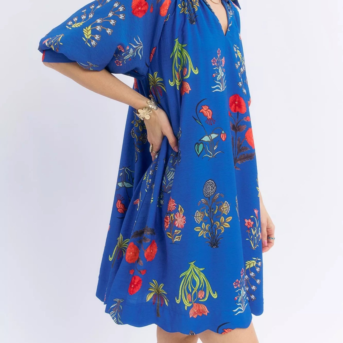 Close up texture shot of the vintage floral encyclopedia botanical print on an Umgee dress from Solazura Boutique