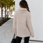Back view of apricot oversized knit cowl neck pullover showing relaxed fit and cowl neckline