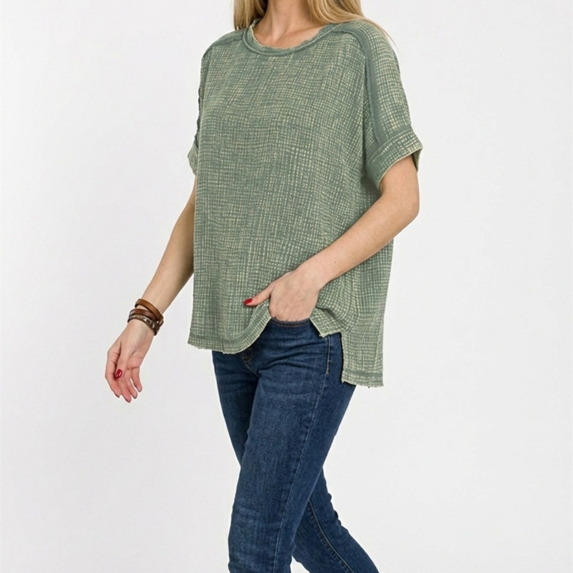Lifestyle shot of the acid-washed double gauze tee styled for a casual outing.