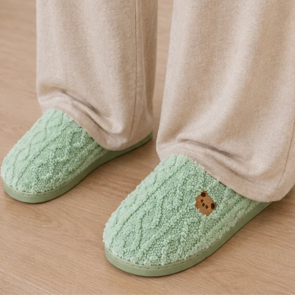 Women's Aspen Cozy Knit House Slippers in green with plush knit texture, embroidered bear accent, and warm artificial wool lining.
