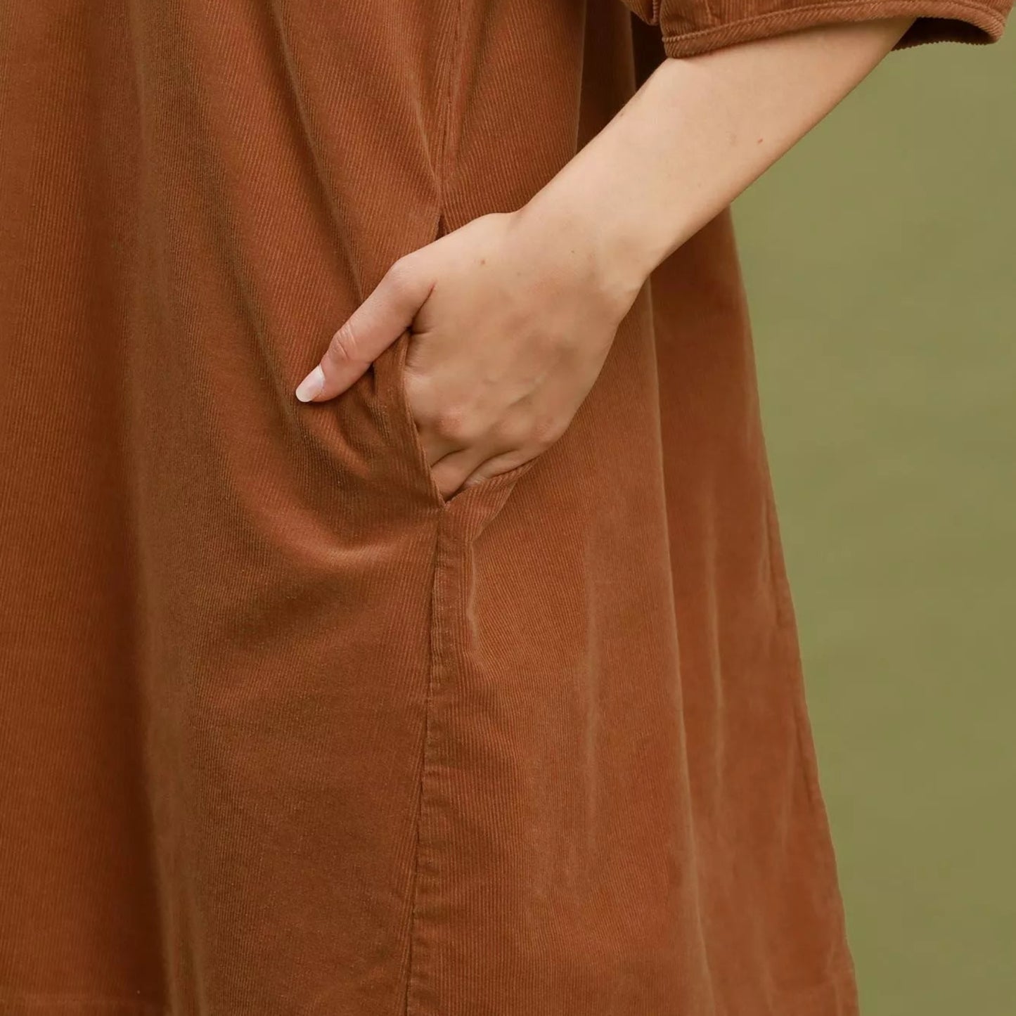 Close up detail of the structured puff sleeve on a camel Umgee corduroy dress from Solazura Boutique