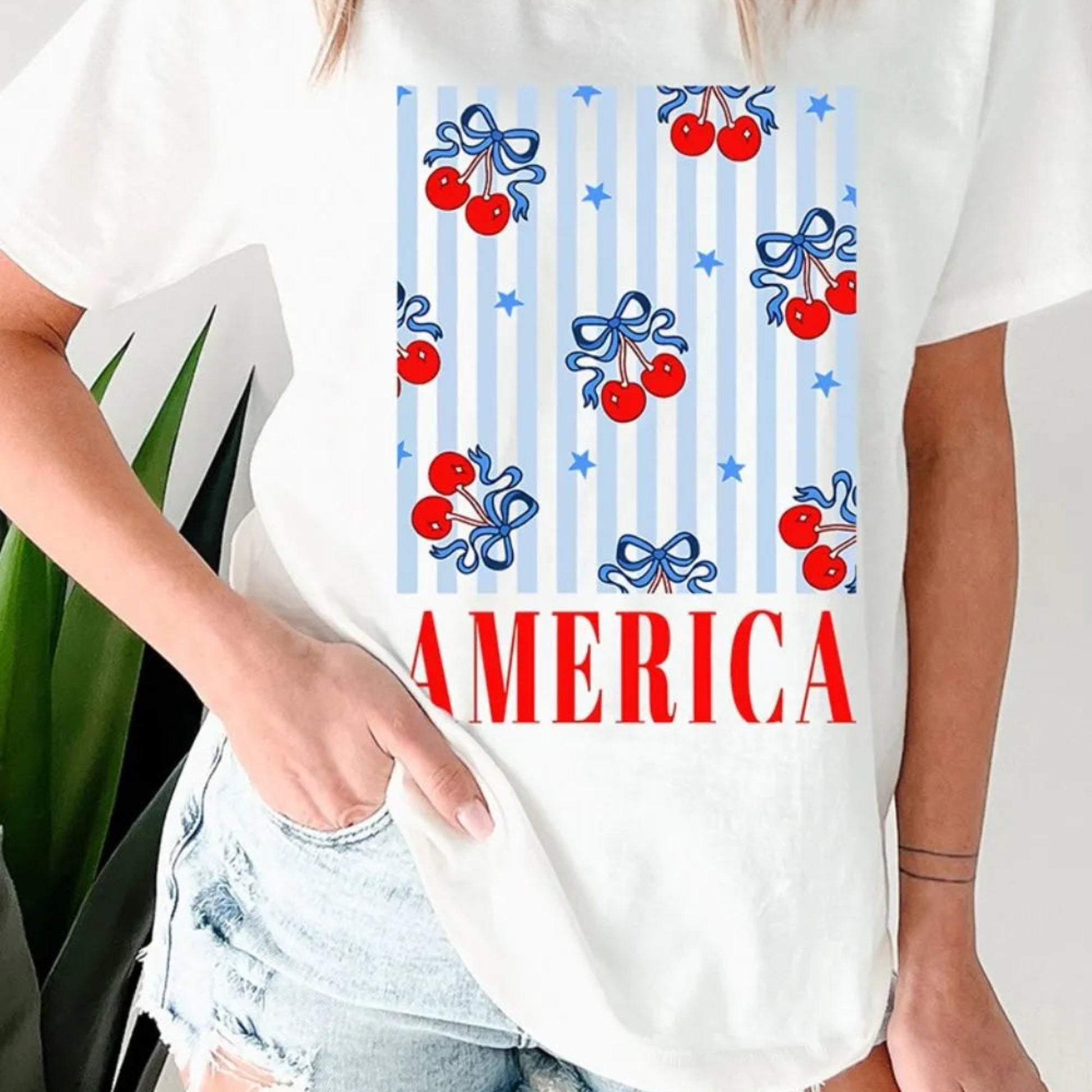 Bow Cherry AMERICA Graphic Crewneck Patriotic T-Shirt in White - Side View