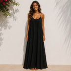 Women's black backless cami maxi dress with a relaxed flowy fit.