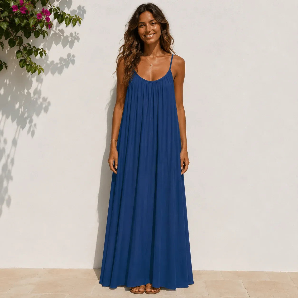 Women's dark blue backless cami maxi dress with a flowy relaxed fit.