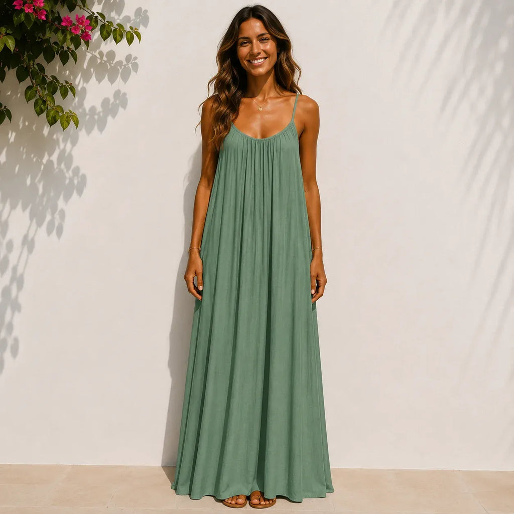 Women's ocean green backless cami maxi dress with a loose flowy silhouette.