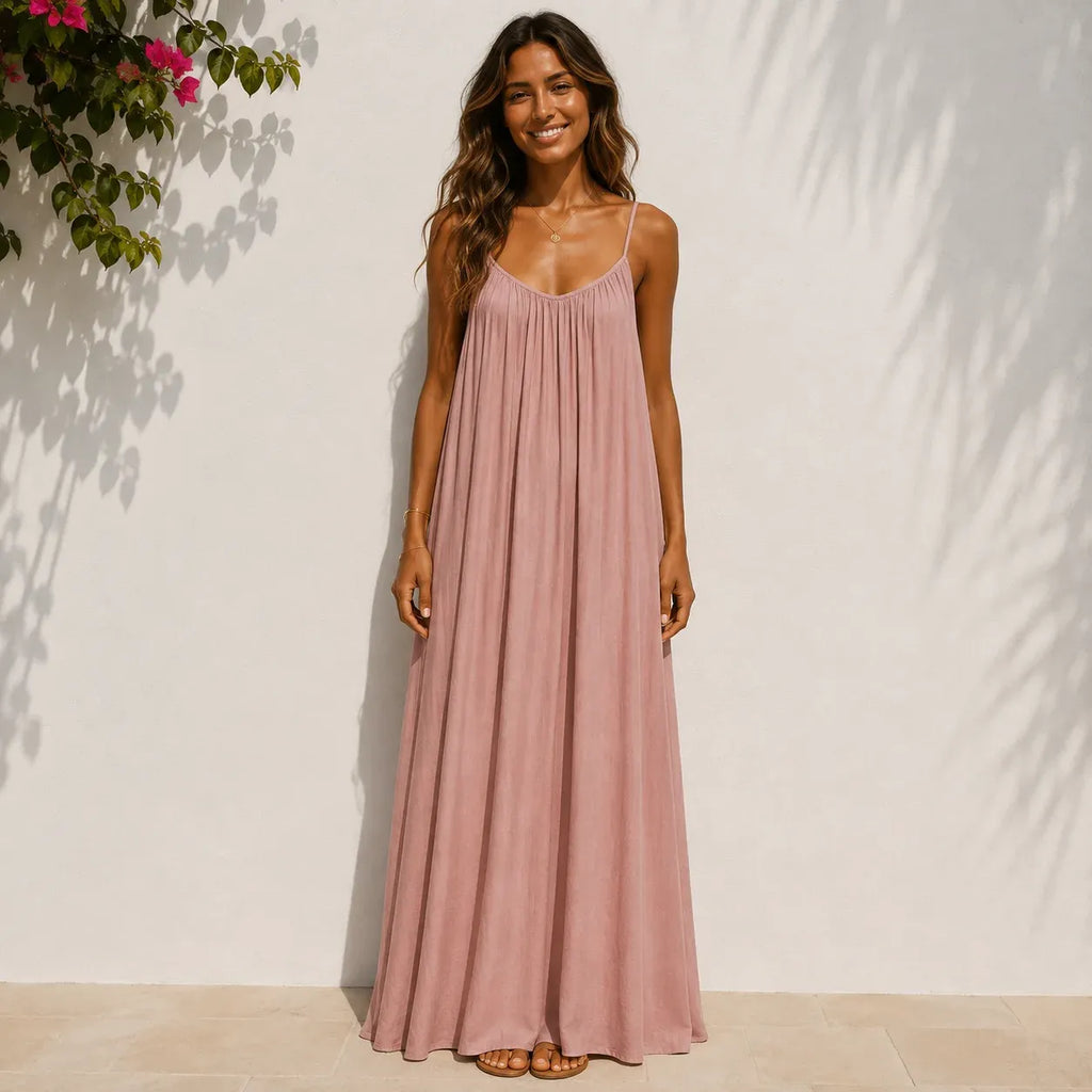 Women's blush pink backless cami maxi dress with a relaxed fit.