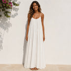 Women's white backless cami maxi dress with a lightweight flowy design.