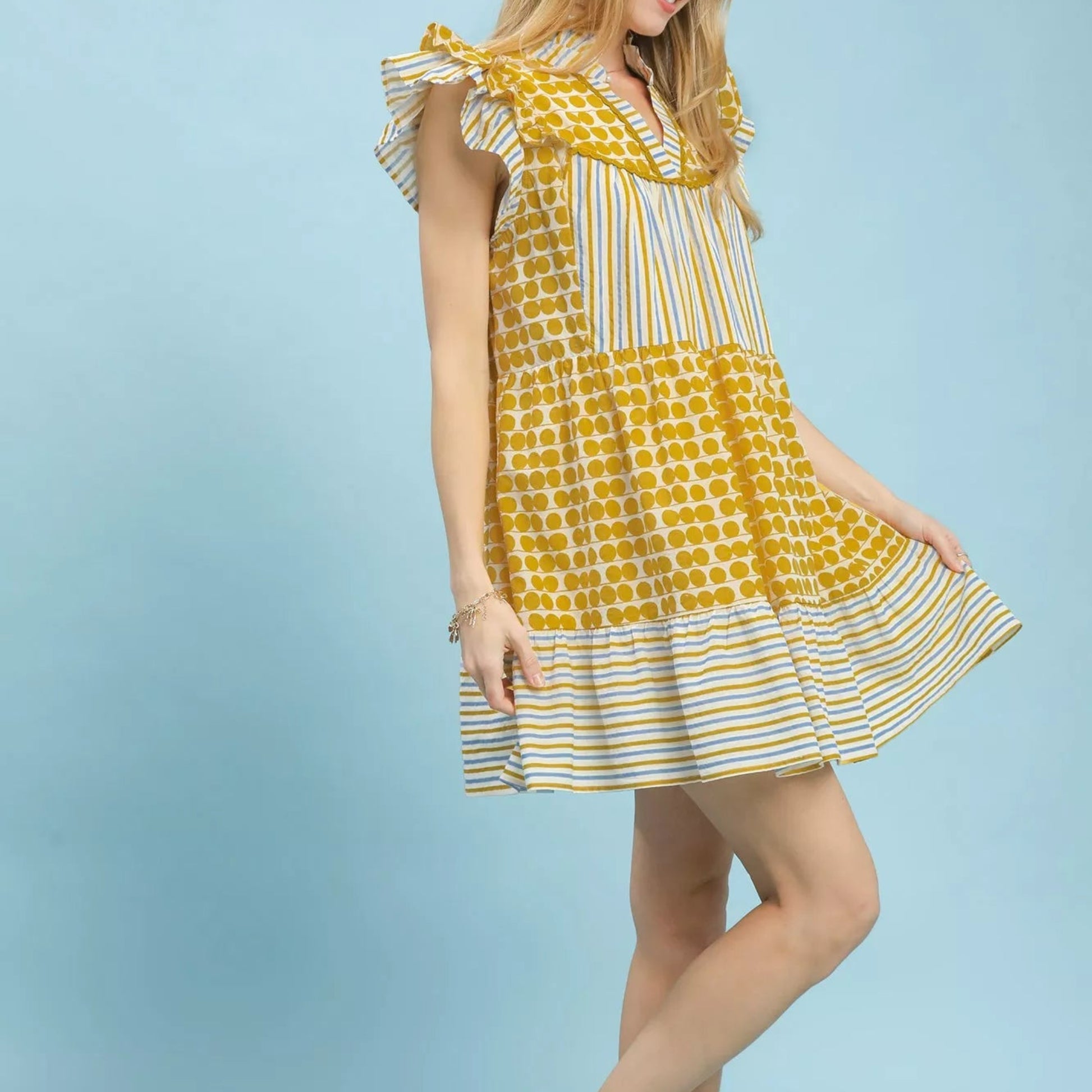 Close up detail of the romantic flutter sleeve on an Umgee mixed patchwork dress from Solazura Boutique
