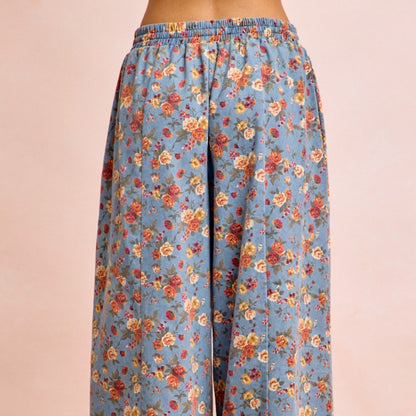 Floral patterned pants on a beige background