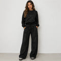 Black sequin long-sleeve sweatshirt and wide-leg pants set for women, front view