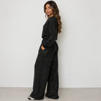 Black sequin long-sleeve sweatshirt and wide-leg pants set for women, side view
