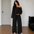 Black women's two-piece wide-leg pants set with off-shoulder long sleeve top
