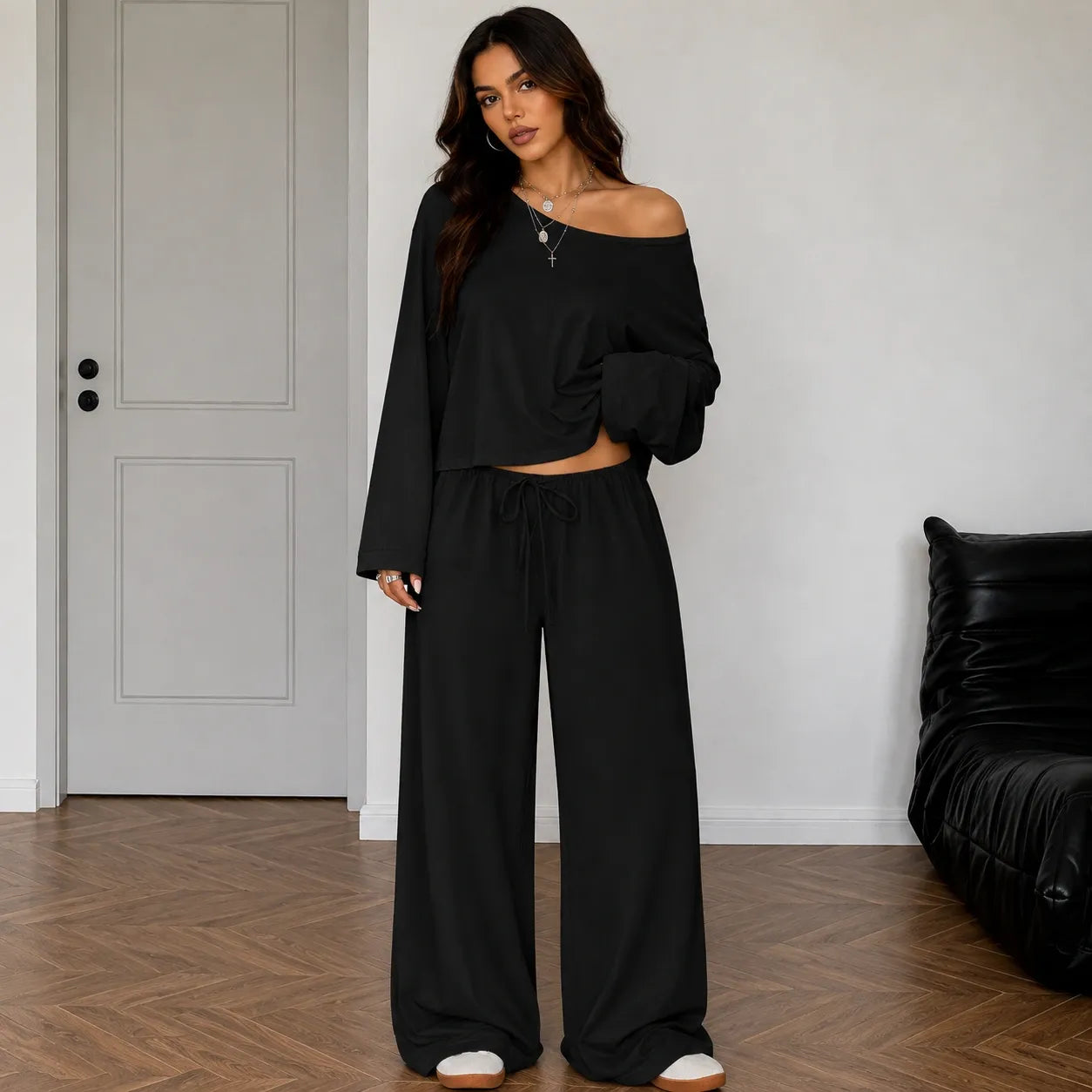 Black women's two-piece wide-leg pants set with off-shoulder long sleeve top