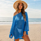 Blue crochet beach cover-up worn over a swimsuit at the beach